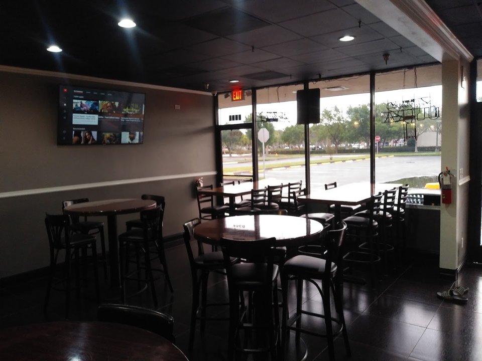 Casual dining room with simple tables and chairs.
